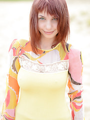 Marvelous busty redhead hippy girl stripping clothes and posing in the nude in the woods.