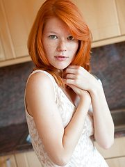 European redhead beauty shows her cherry on the kitchen