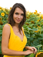 Semmi strips her yellow sexy dress and   dazzles us with her voluptuous body   with super smooth and fair skin, puffy large breasts, and her alluring blue eyes in the sunflower field.