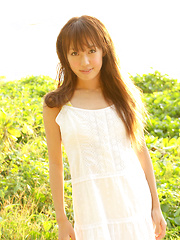 Nozomi Kawasaki Asian in yellow bath suit enjoys the sun and sea