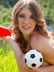 Sexy brunette spreads her legs in the sunshine by the pond, feeling true lustfulness and passion while she does poses.